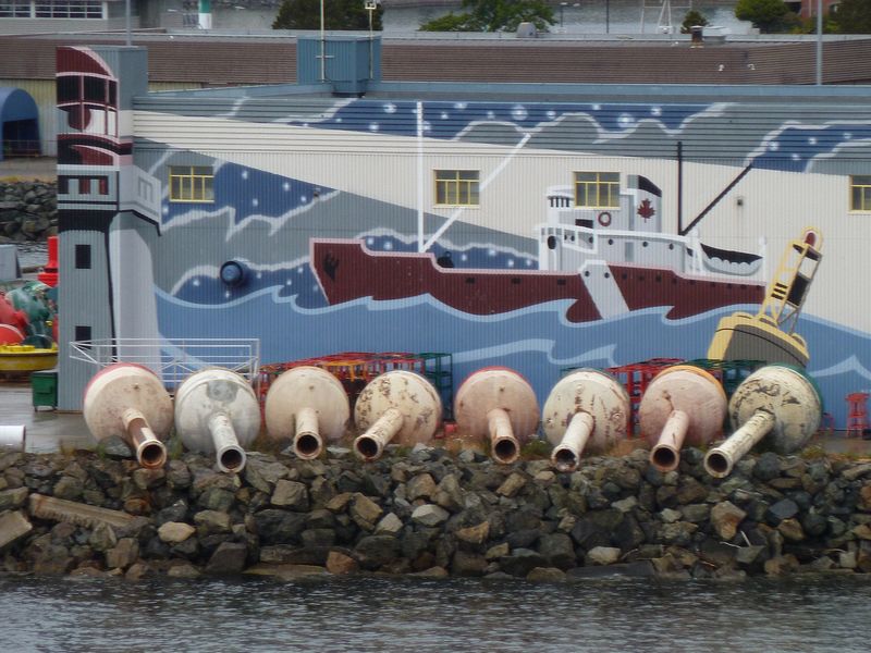 Buoys in front of a colorful building