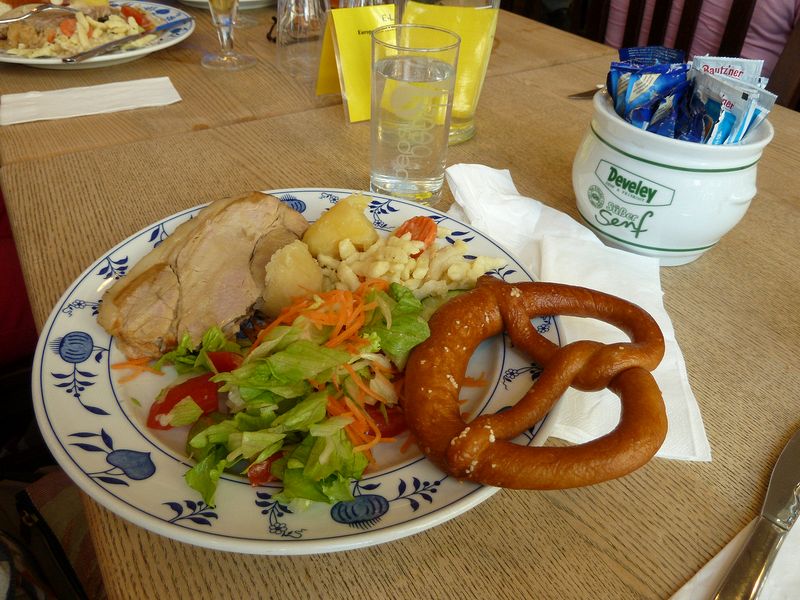 Pork roast, salad, spaetzle, and a pretzel