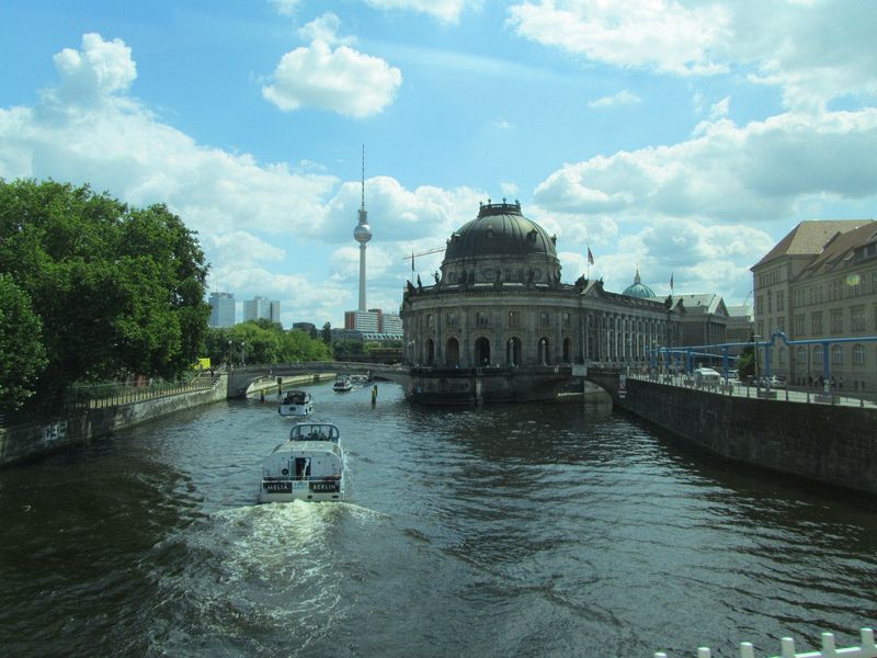 Tour boats go by the museums