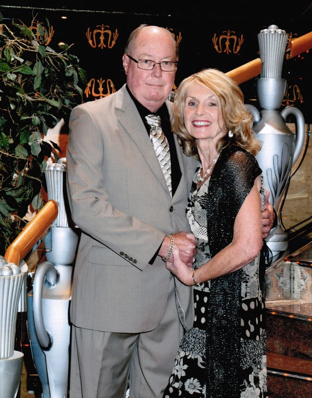 Formal portrait of Livingston and Eloise on stairs