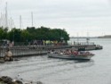 A tour boat pulls in close to see the statue