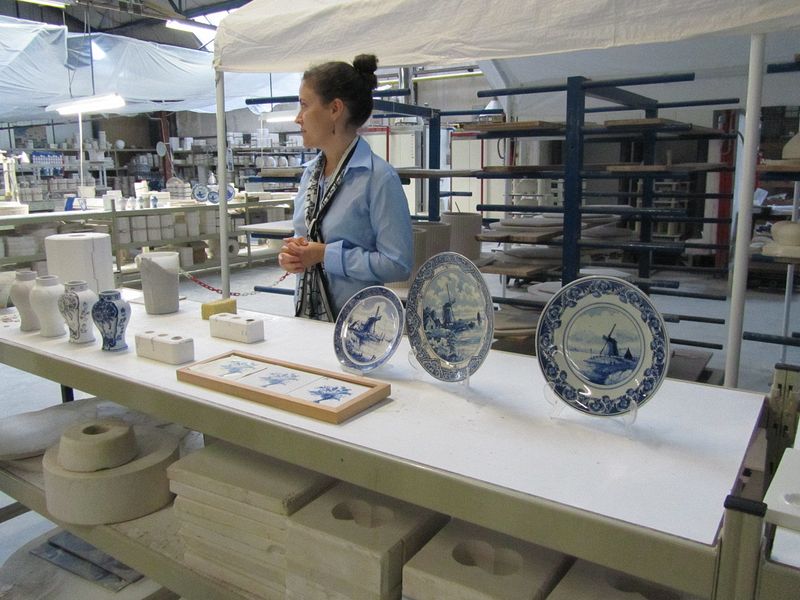 Tour guide demonstrating the manufacturing process