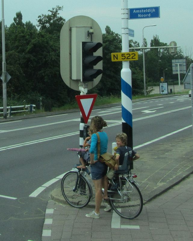 Typical Mom with two kids on her bicycle