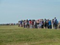 Crowds of people circle the stones