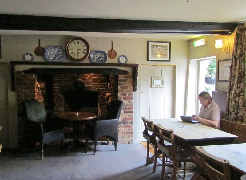 June checks her email in the pub