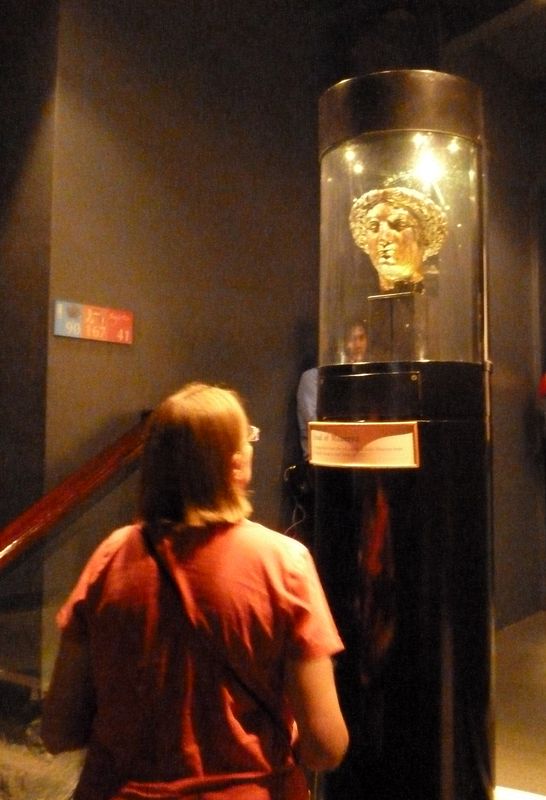 June looks at the goddess Minerva's head