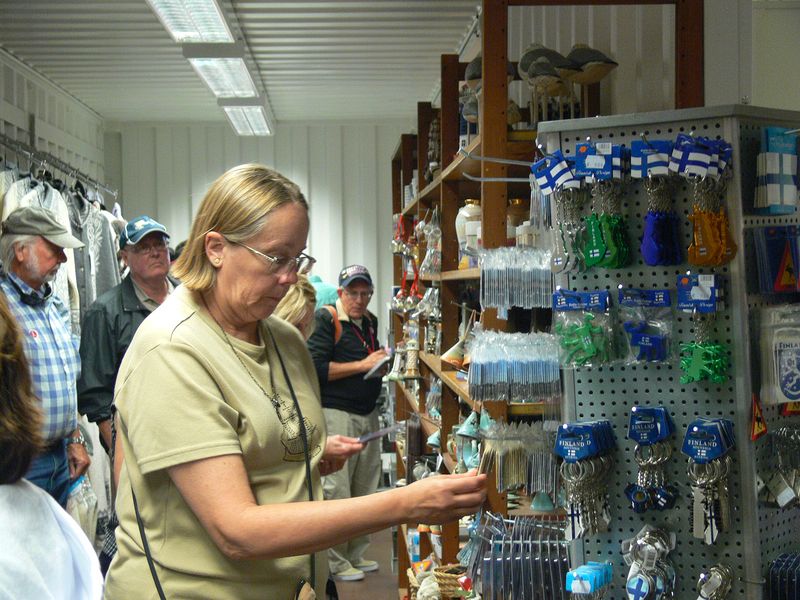 June shops for souvenirs at a store at the pier