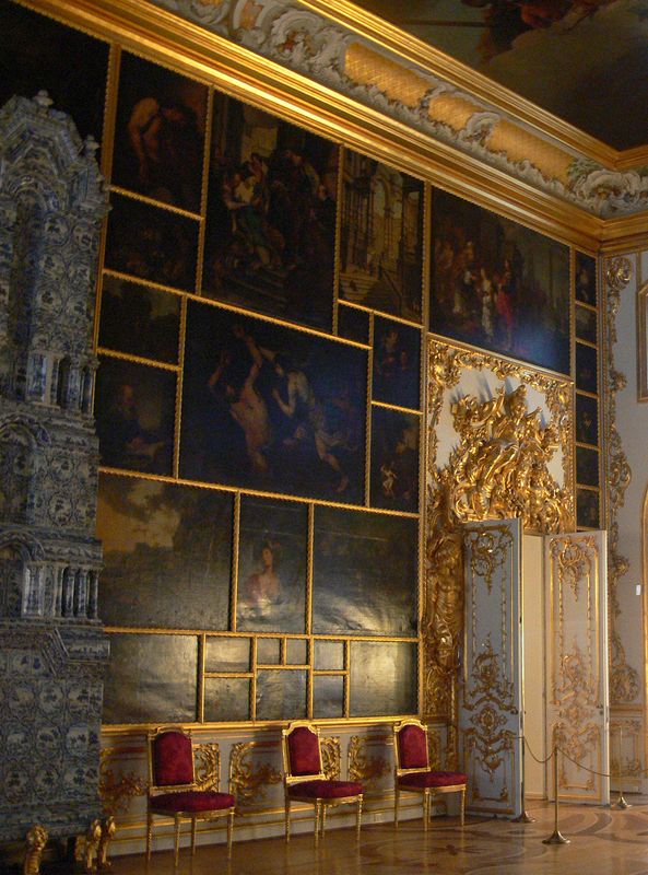 Paintings cover one wall