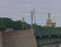 People wave from a bridge as we head towards the Church of the Spilled Blood