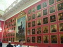 Portraits along one wall