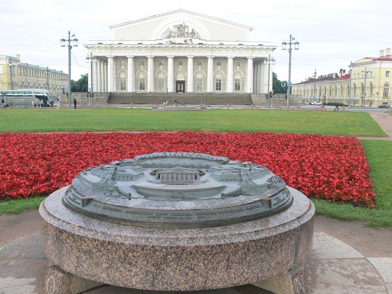 The old stock exchange building with model in front