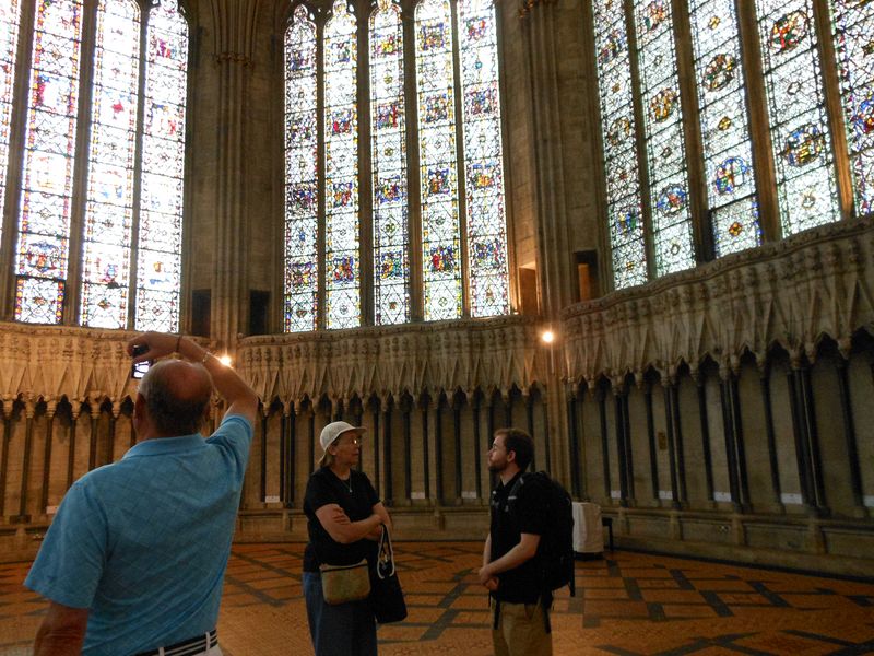 June talks to Ehren in the chapter house as Livingston takes a picture