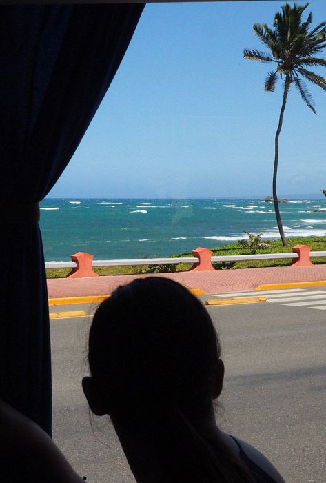 We see a local beach from the bus