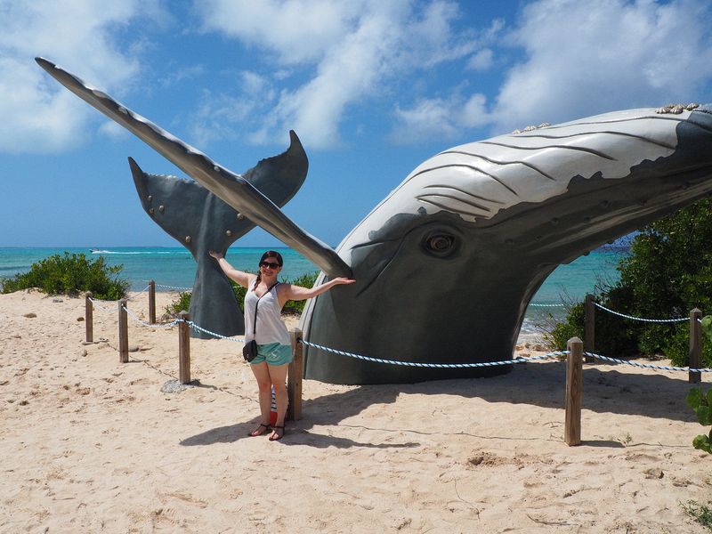 Jessica next to a statue of a whale