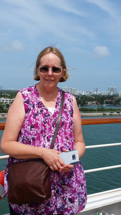 June at the ship's railing