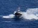 A pilot boat comes out to our ship