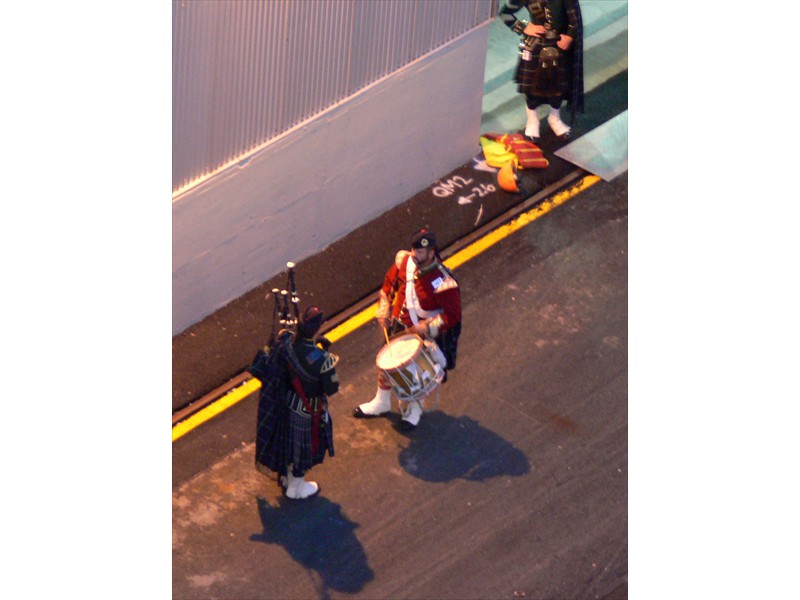 A drummer and bagpiper are ready to greet us