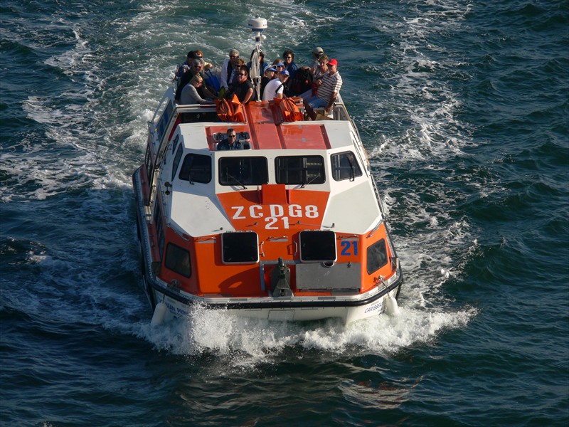 A tender returns to the ship