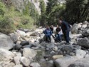 The family in a rocky stream bed