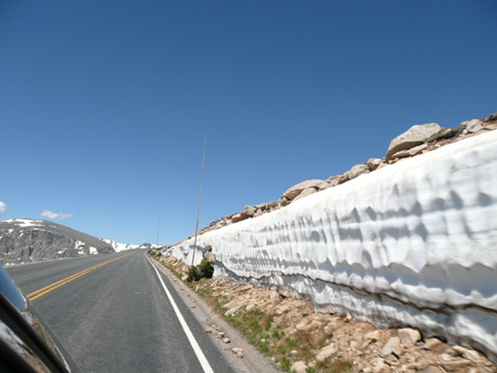 042 tall snow bank along road - 65 degrees