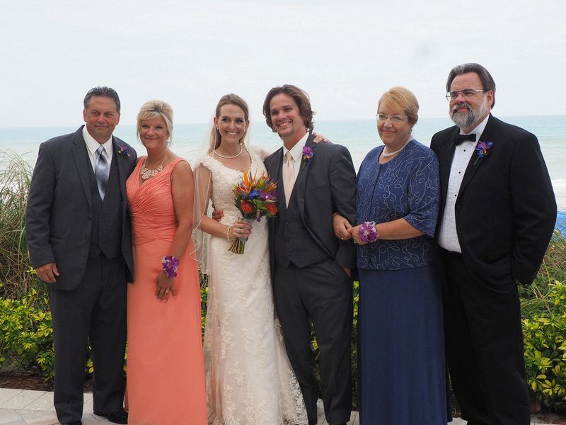 The bride and groom with their parents