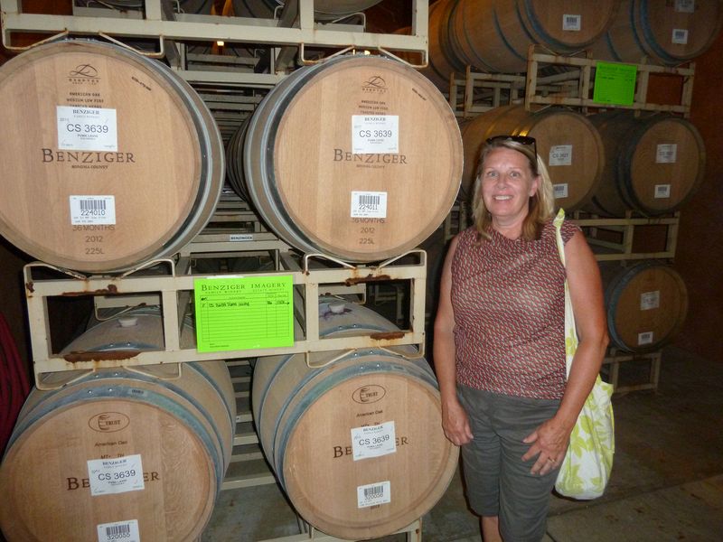 Diane next to some barrels