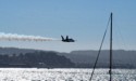 A lone Blue Angel buzzes low over the Bay