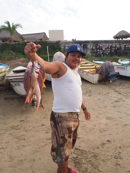 A local guy shows us his catch