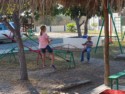 Cora and Grant on a teeter totter at the Salavation Army Orphanage