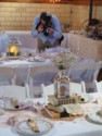 A photographer takes pictures of the place settings