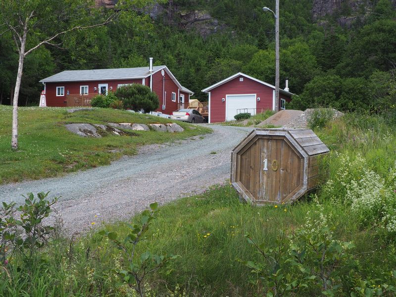 A typical Newfoundland house with trash container