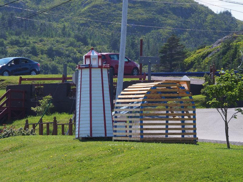 Decorative lighthouse and lobster pot