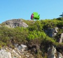 Eloise next to a large decorative chair on a cliff