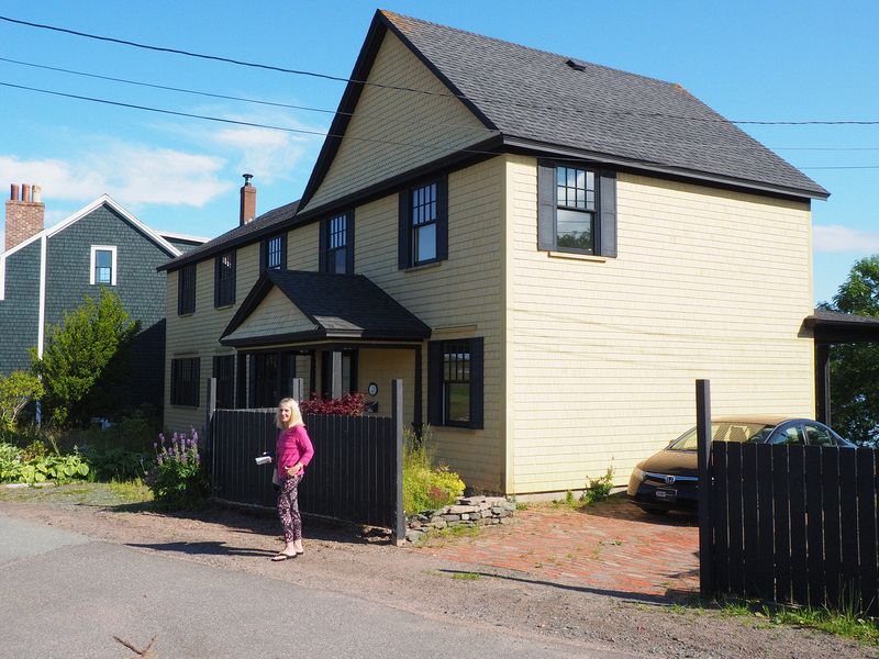 Eloise next to a relative's house