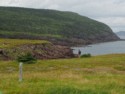 Someone views the rocky coastline