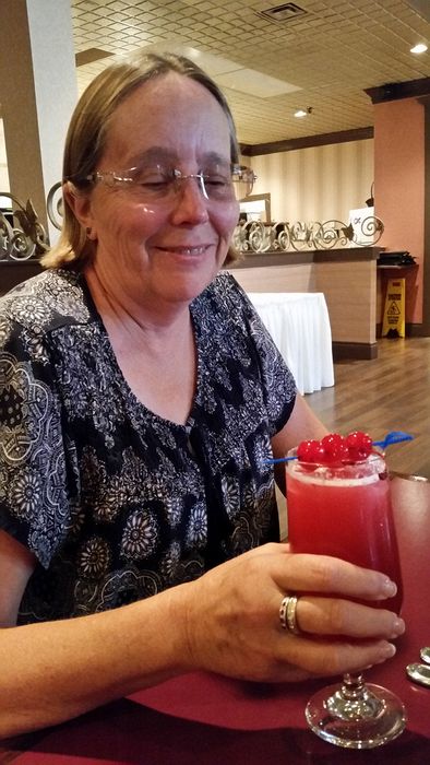 June gets a very red drink