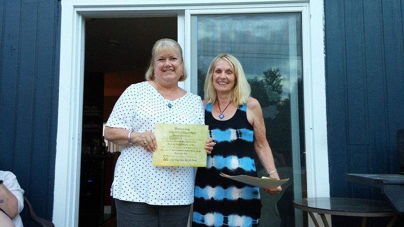 Linda gets her certificate making her an honorary Newfoundlaner