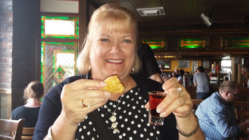 Linda gets ready to kiss the cod for her screech-in