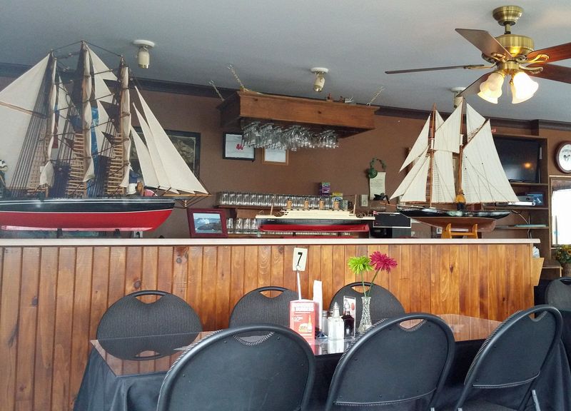 Ship models on the counter at a restaurant