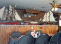 Ship models on the counter at a restaurant