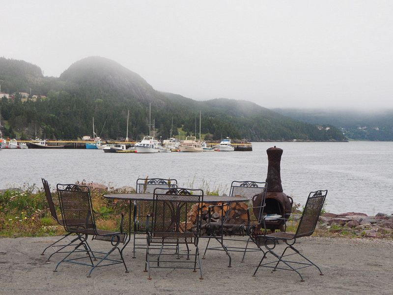 Table and chairs with view of the boat harbor