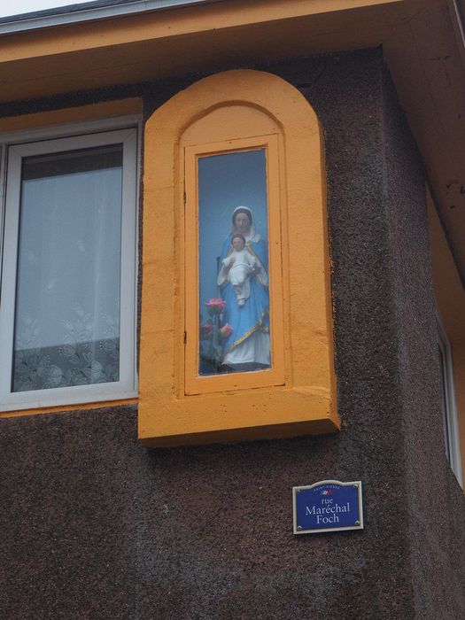 Virgin Mary shrine on a building