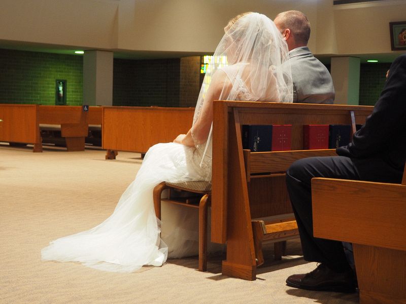 The bride and groom await their vows