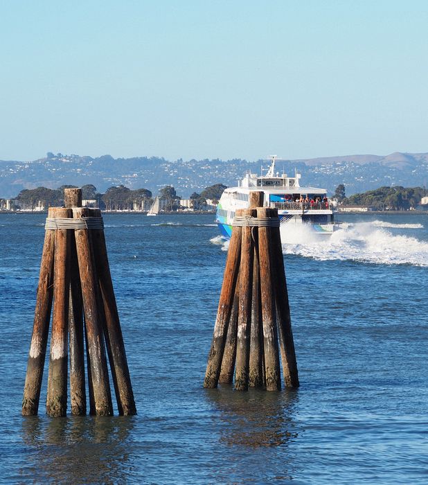 Ferry leaves past pilings