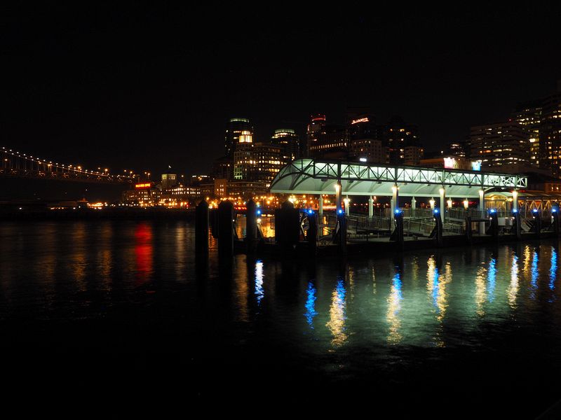 Ferry terminal lights reflect on the water