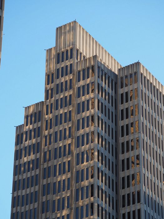 Mottled reflection on a tall building