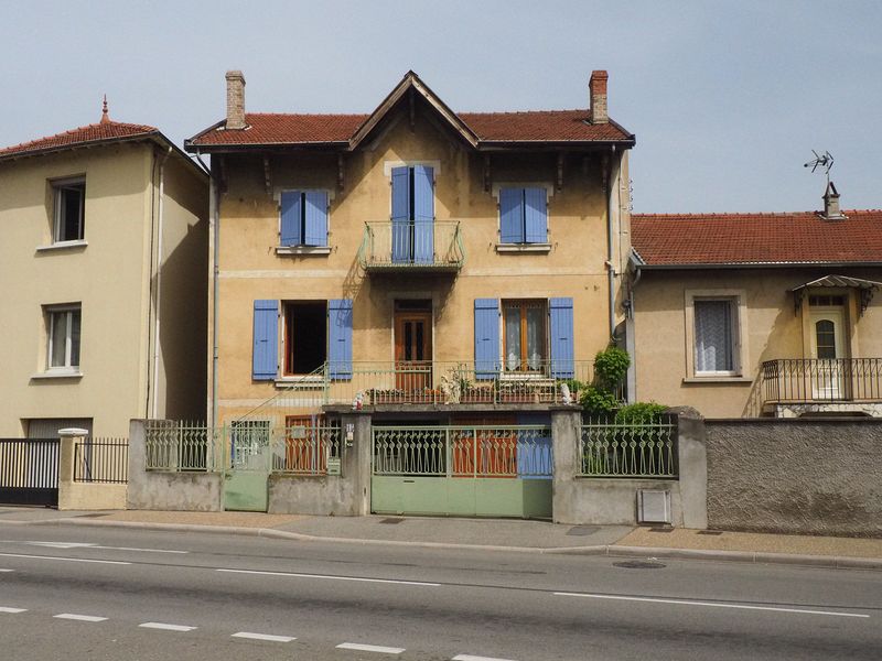 An old house with pretty blue shutters