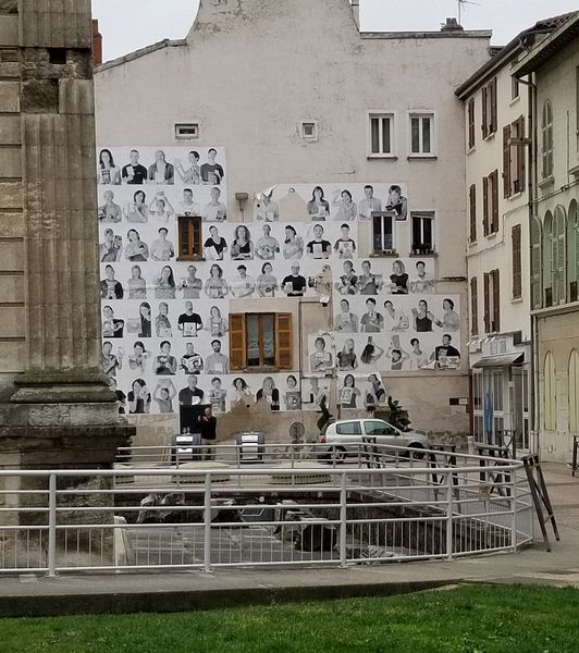 Posters of people holding books