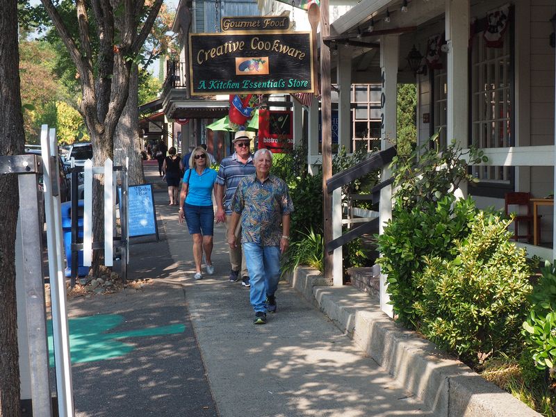 Eloise, Livingston and Ron walk down the street in Murhpys